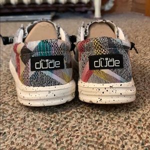 These are a pair of “Hey Dude” shoes